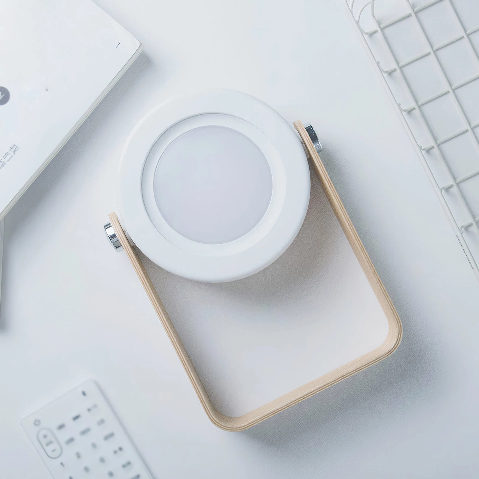Compact lantern table lamp with dimmable LED technology, shown in contemporary living space interior