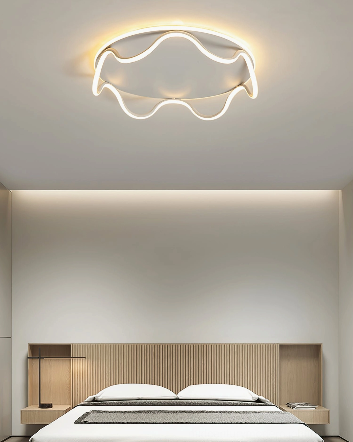 Compact wavy LED ceiling light casting soft illumination in Scandinavian-style bedroom with wood grain headboard
