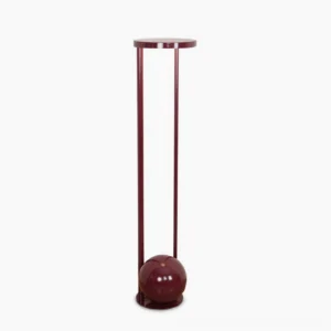 Composition red floor lamp front view - sculptural mid-century modern design with cylindrical metal legs and circular acrylic diffuser on white background