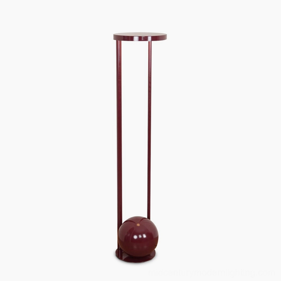 Composition red floor lamp front view - sculptural mid-century modern design with cylindrical metal legs and circular acrylic diffuser on white background