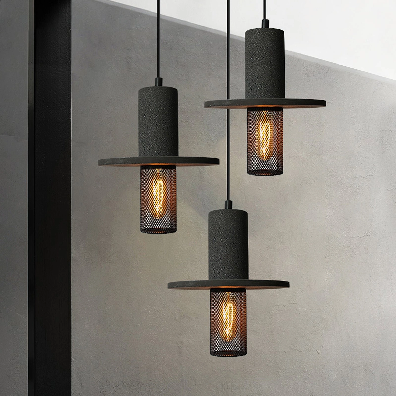 Three-head Condo industrial pendant fixture hanging in modern interior space showing angled perspective against gray wall with uniform rustic design