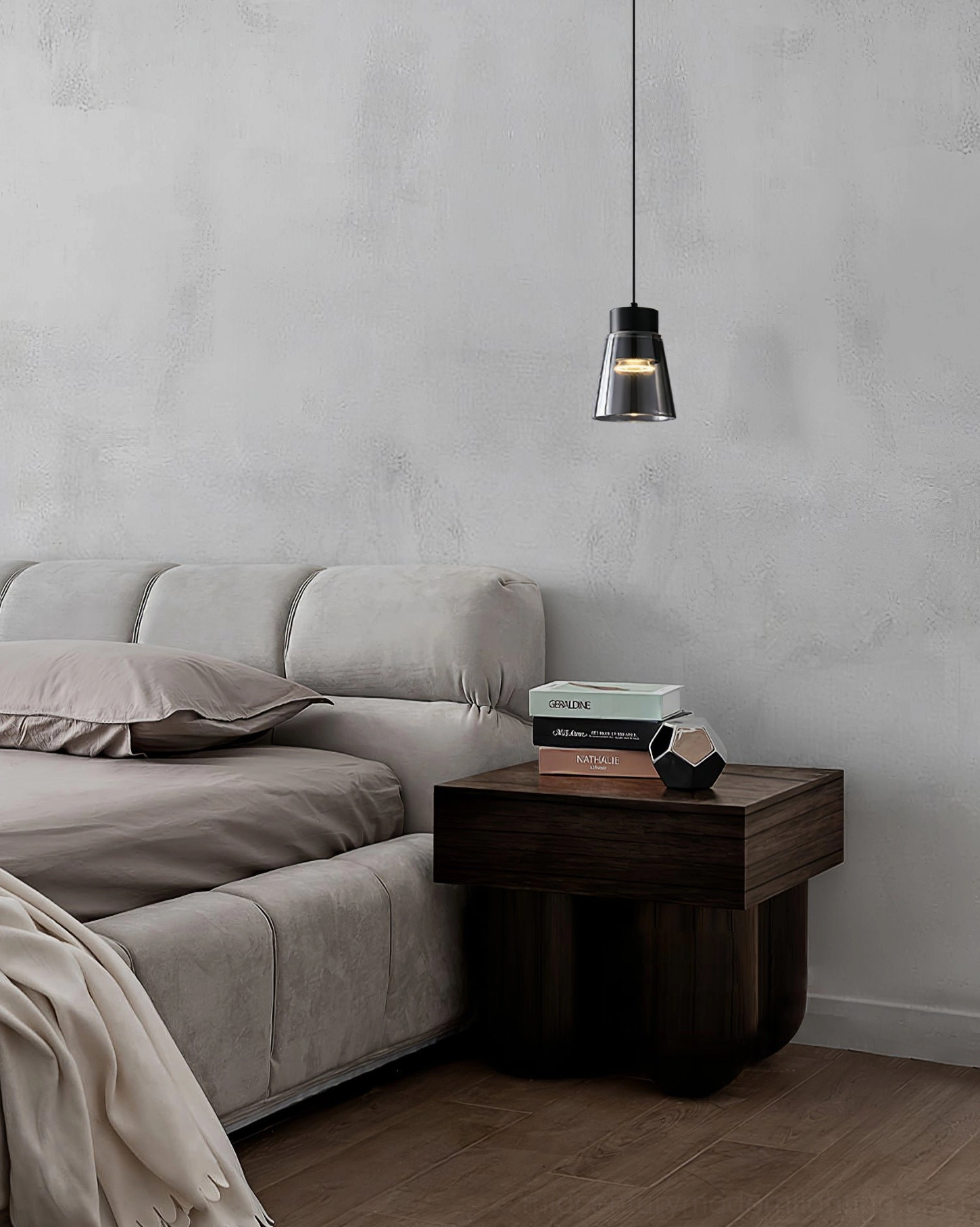 Smoke grey cone pendant above bedroom with ribbed accent wall, modern lighting design
