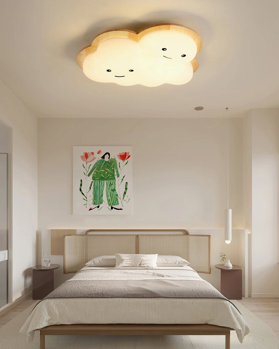 Contemporary bedroom with smiling cloud ceiling light fixture, wall artwork, and calm minimalist design