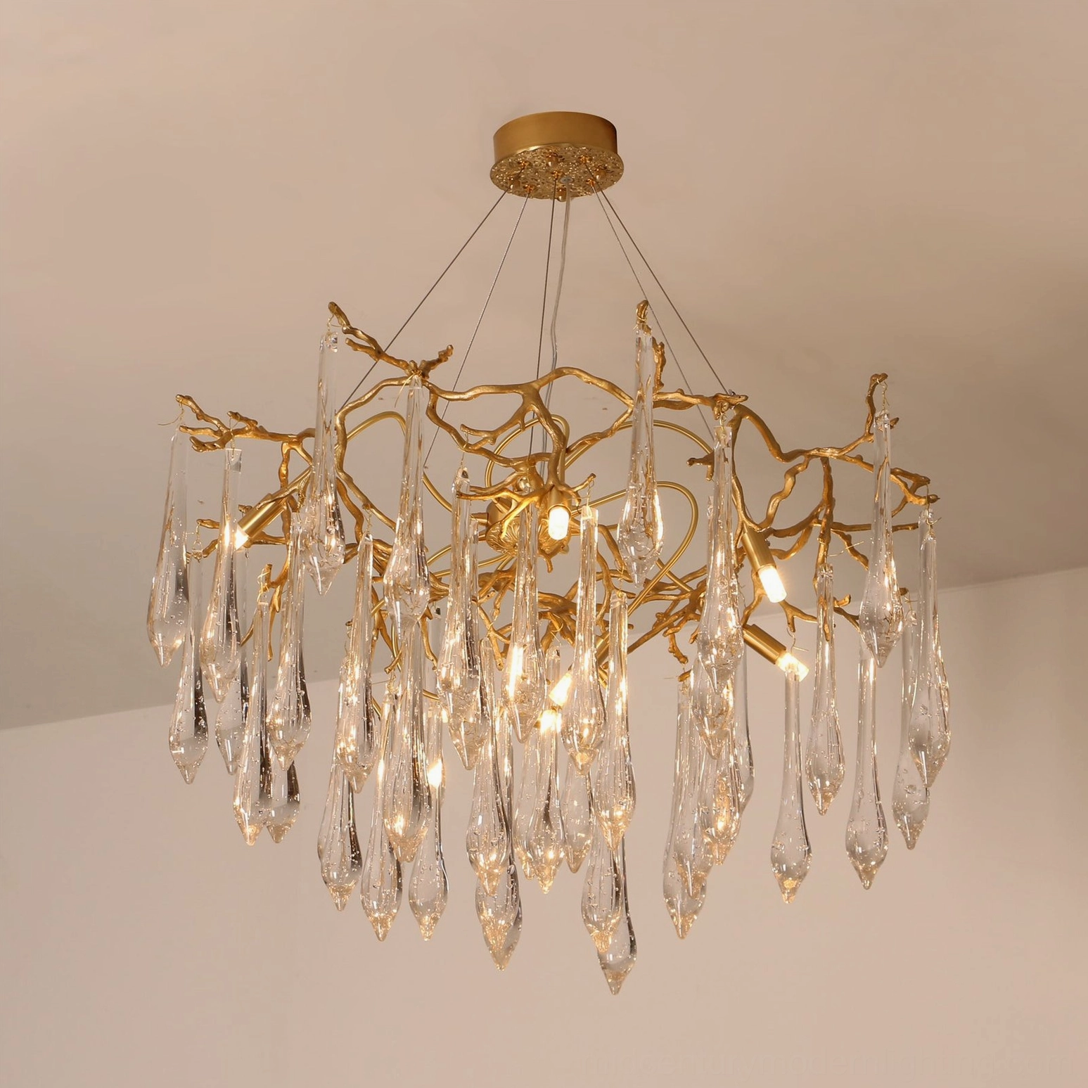 Contemporary branch-style crystal chandelier with adjustable ceiling mounting system