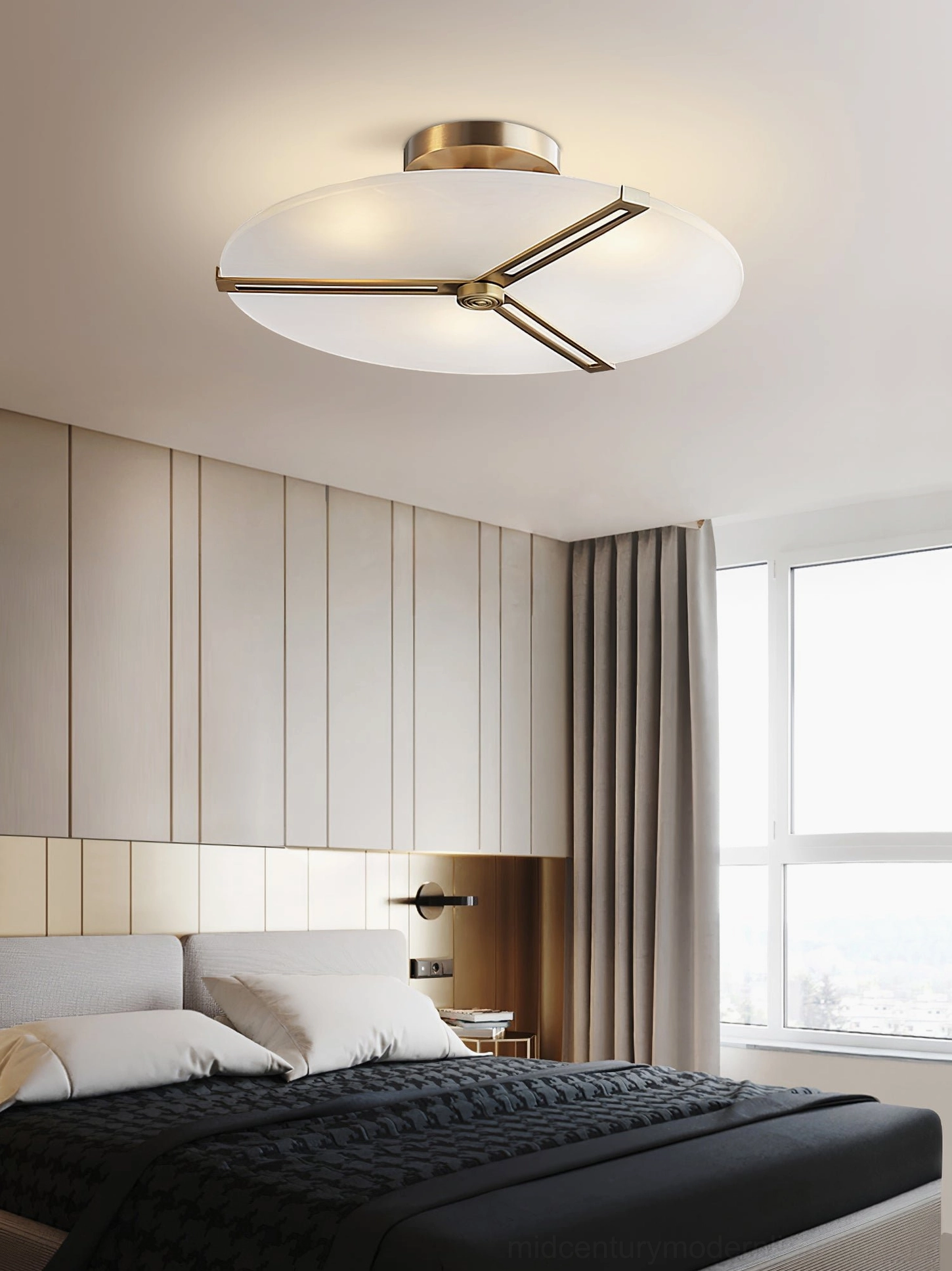 Contemporary brass ceiling fixture with frosted glass diffuser in modern home setting