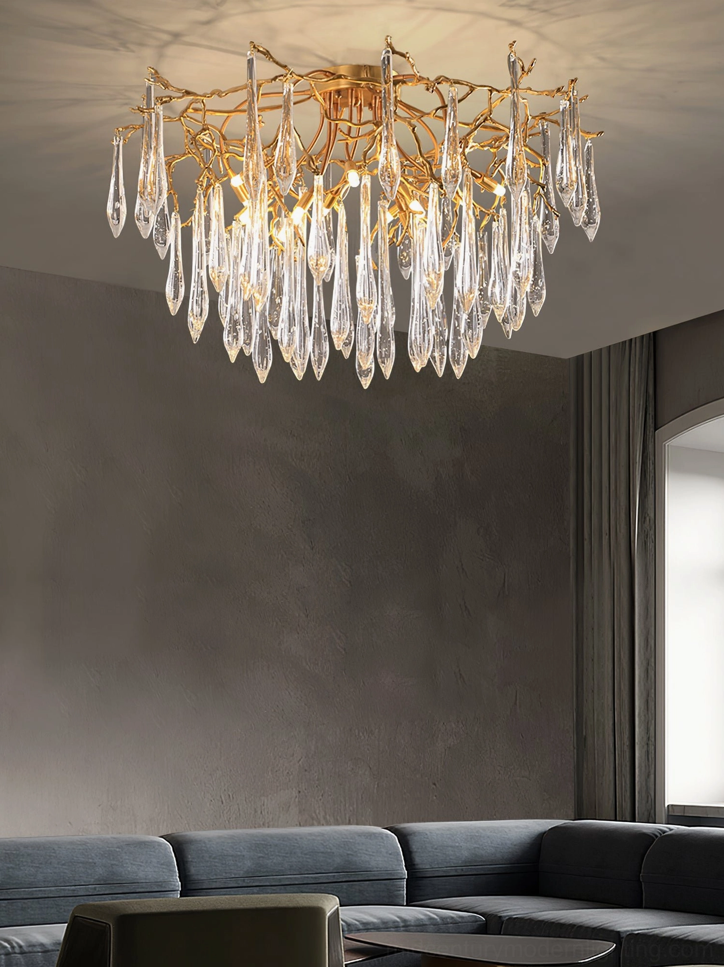 Contemporary brass teardrop ceiling fixture in minimalist interior space