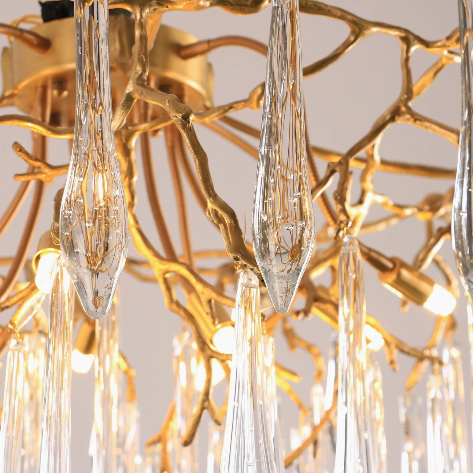 Contemporary ceiling pendant fixture with brass frame and hand-blown glass teardrops