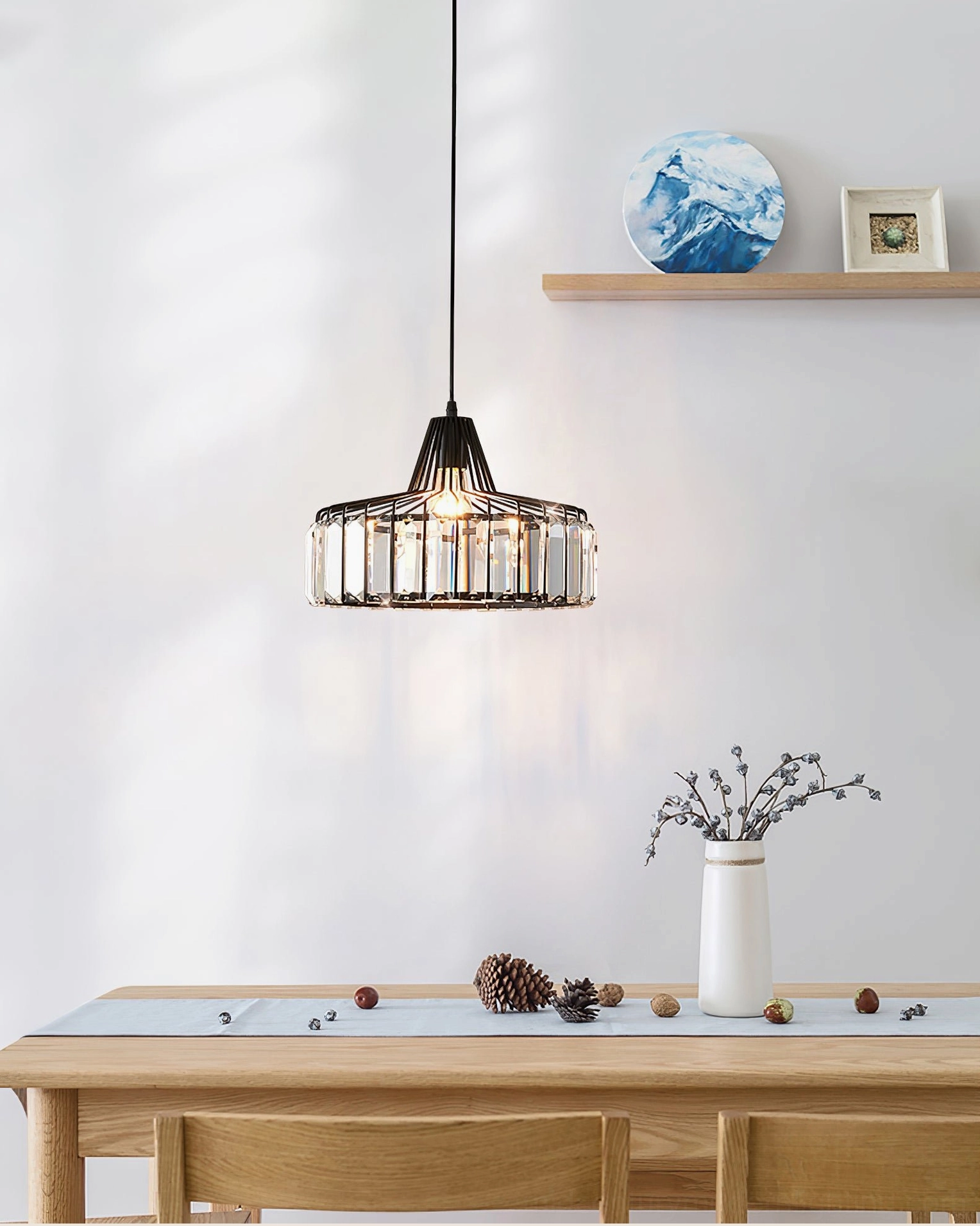 Contemporary pendant light with crystal accents in neutral modern dining room interior