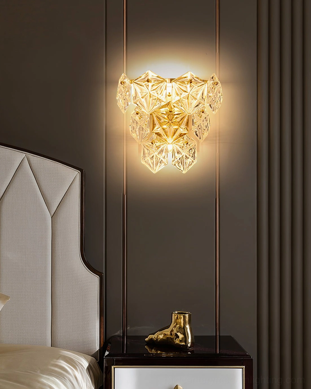 Contemporary geometric crystal wall lamp showcasing faceted glass design and warm illumination