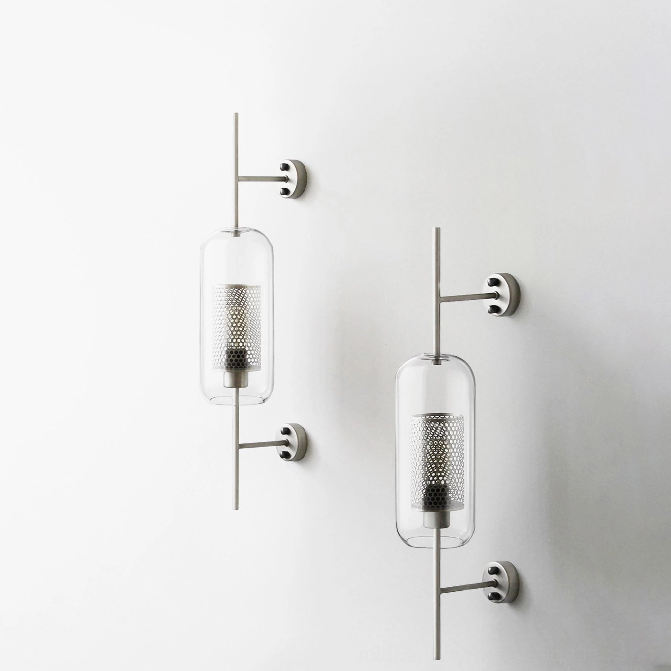 Contemporary glass wall lamp with clear shade and minimalist metal frame