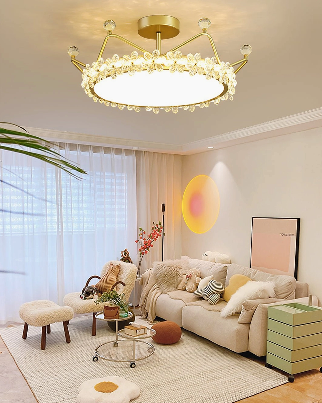 Contemporary gold crystal ceiling light installed in modern living room lounge, overhead view showing cozy family space ambiance