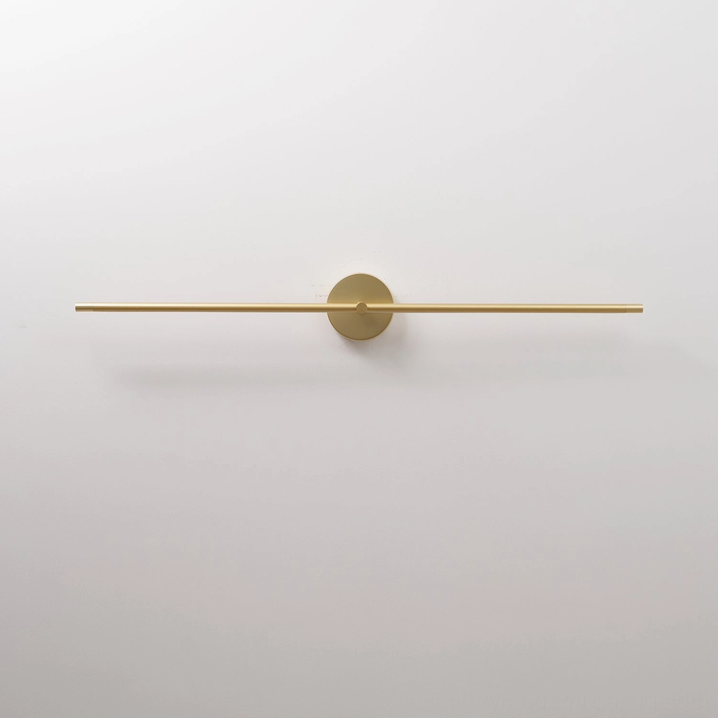 Contemporary gold linear wall lamp mounted on wall creating ambient lighting