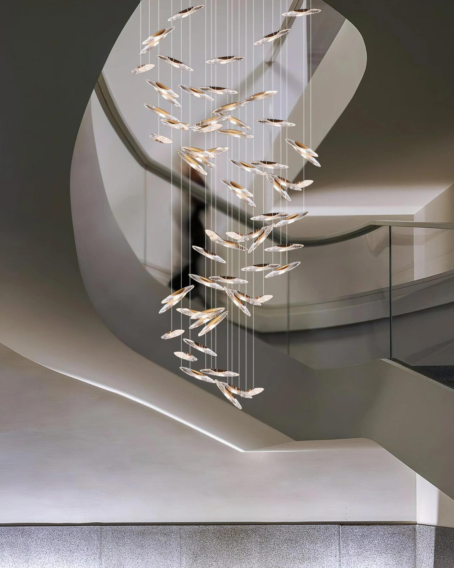 Contemporary hung glass chandelier showing light dispersion through crystalline pendants