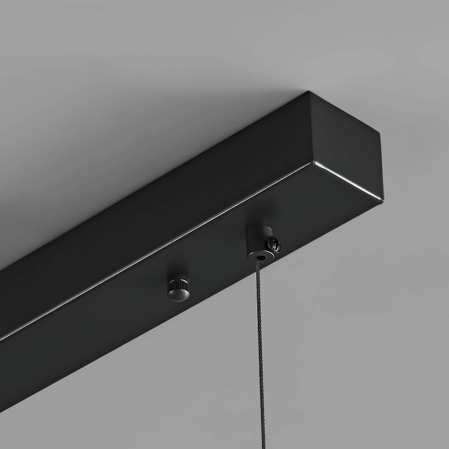 Contemporary linear pendant chandelier in neutral minimalist interior design setting