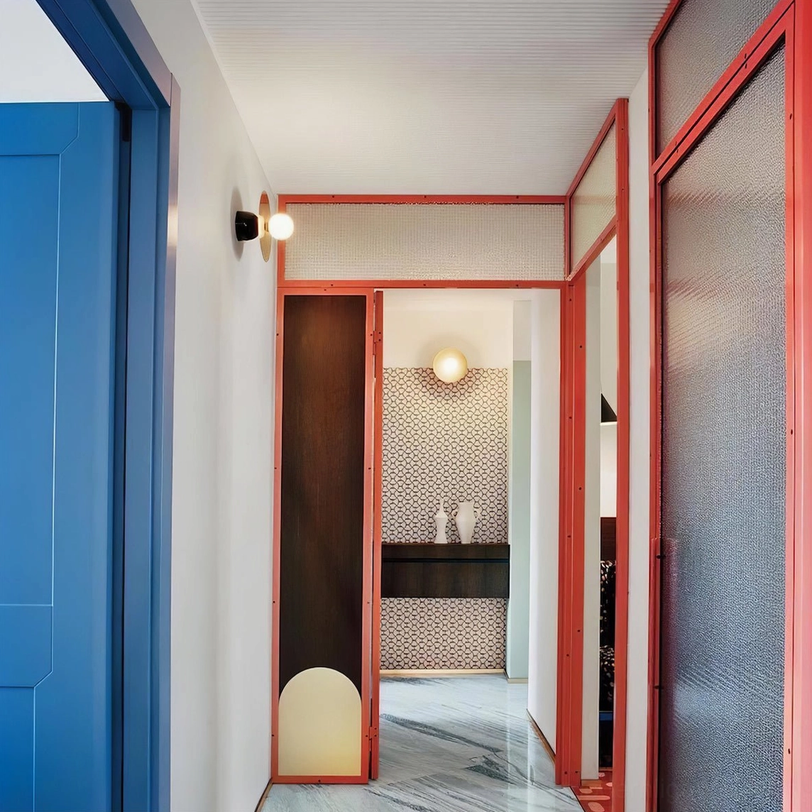 Minimalist disc and sphere wall light fixture with clean architectural lines