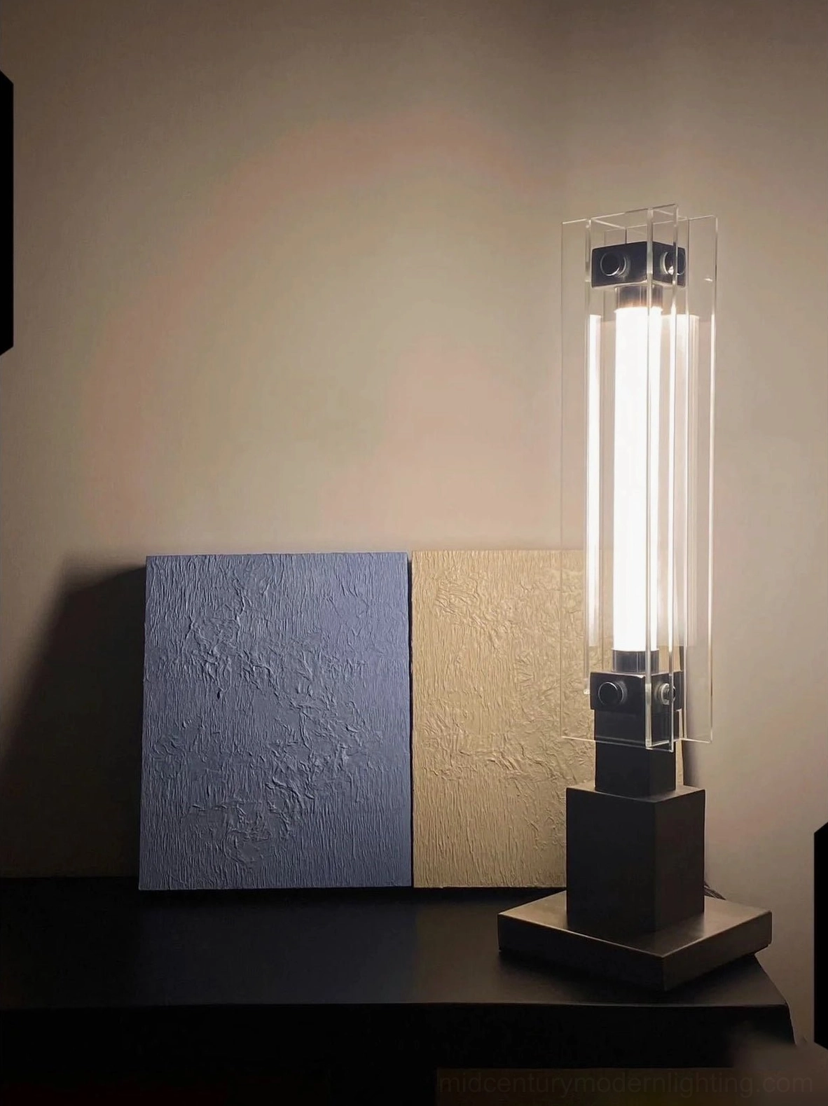 Full product shot of contemporary minimalist table lamp with clean lines and industrial charm