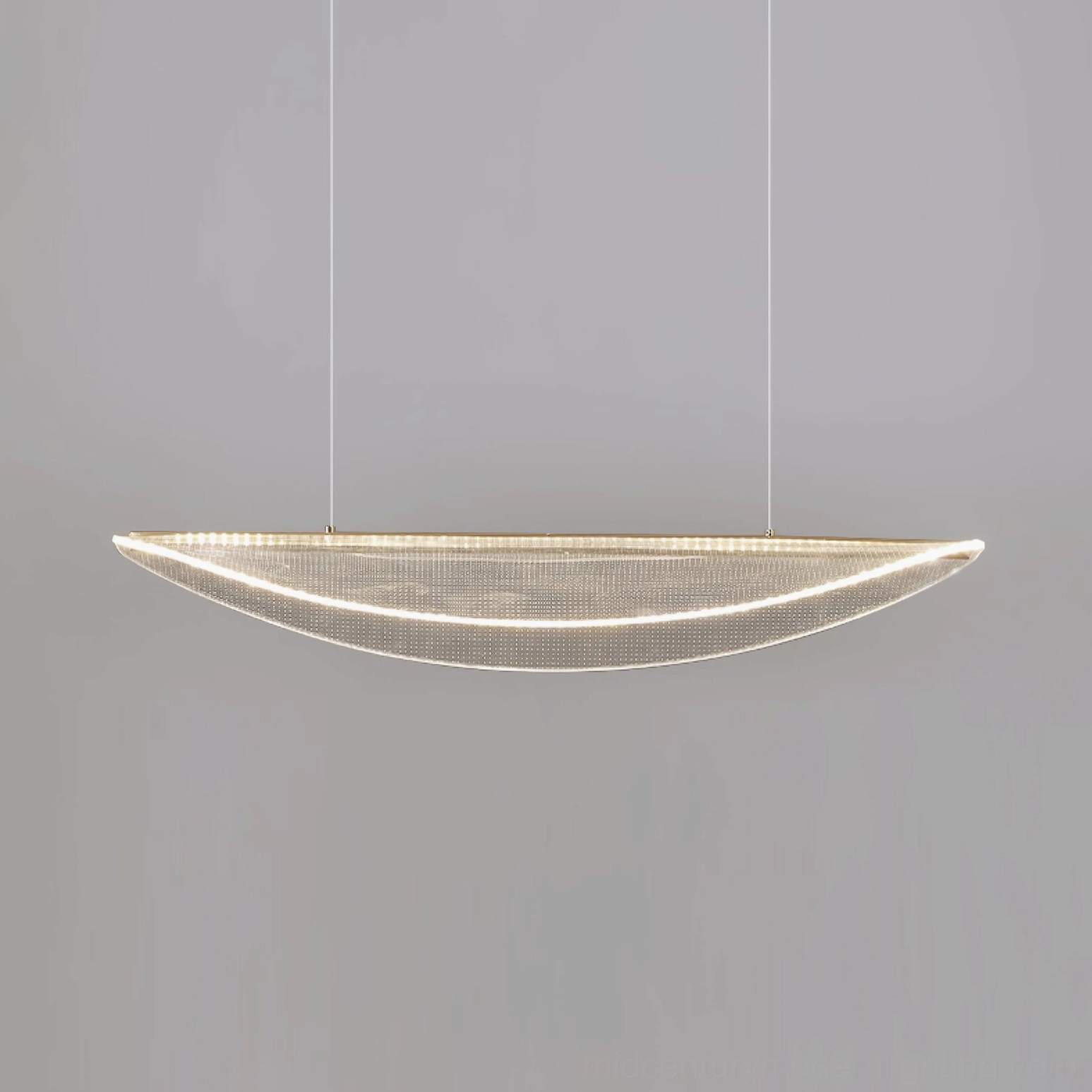 Contemporary pendant light with perforated shade creating soft diffused illumination