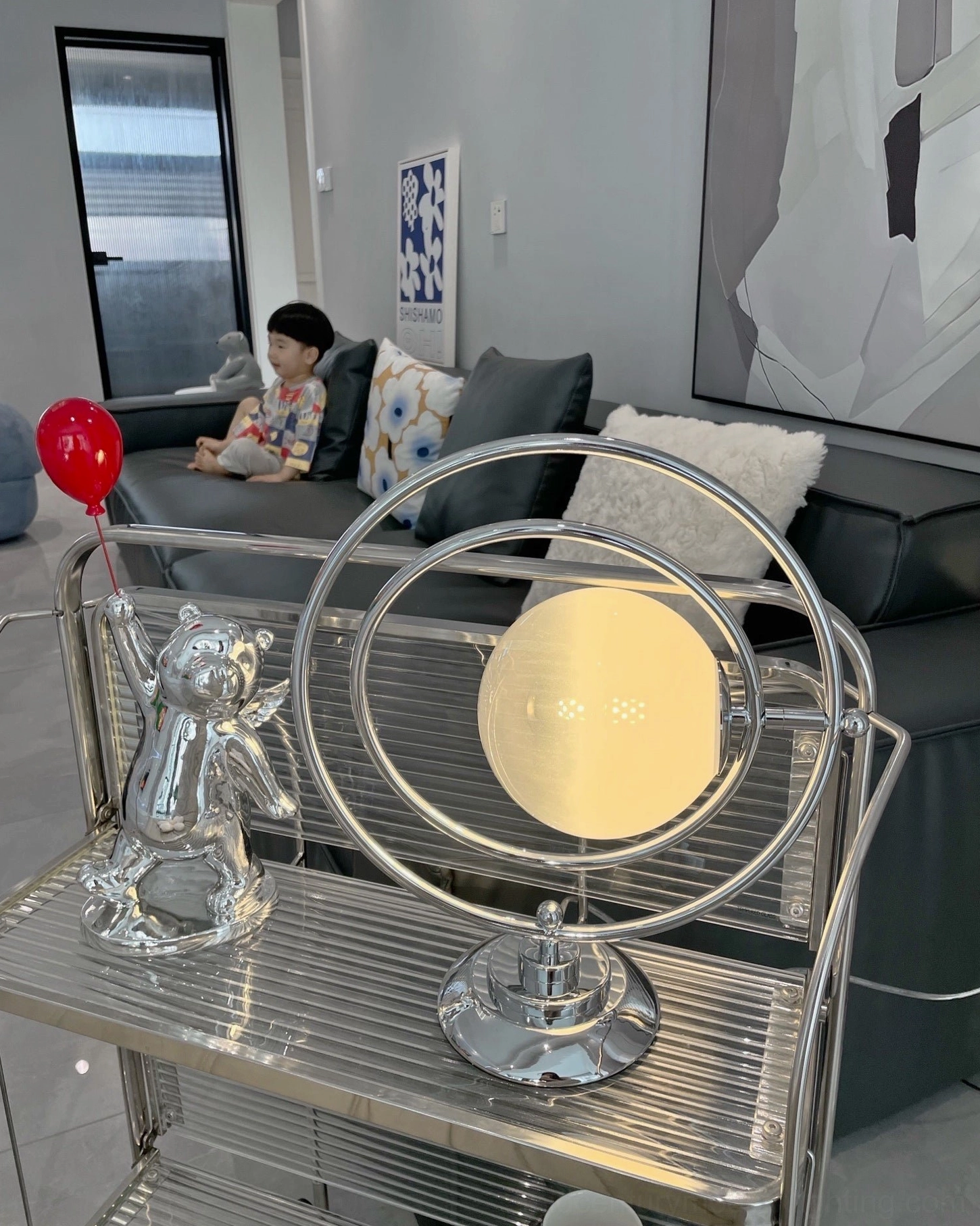 Contemporary planet lamp accent piece with frosted glass and chrome metal construction