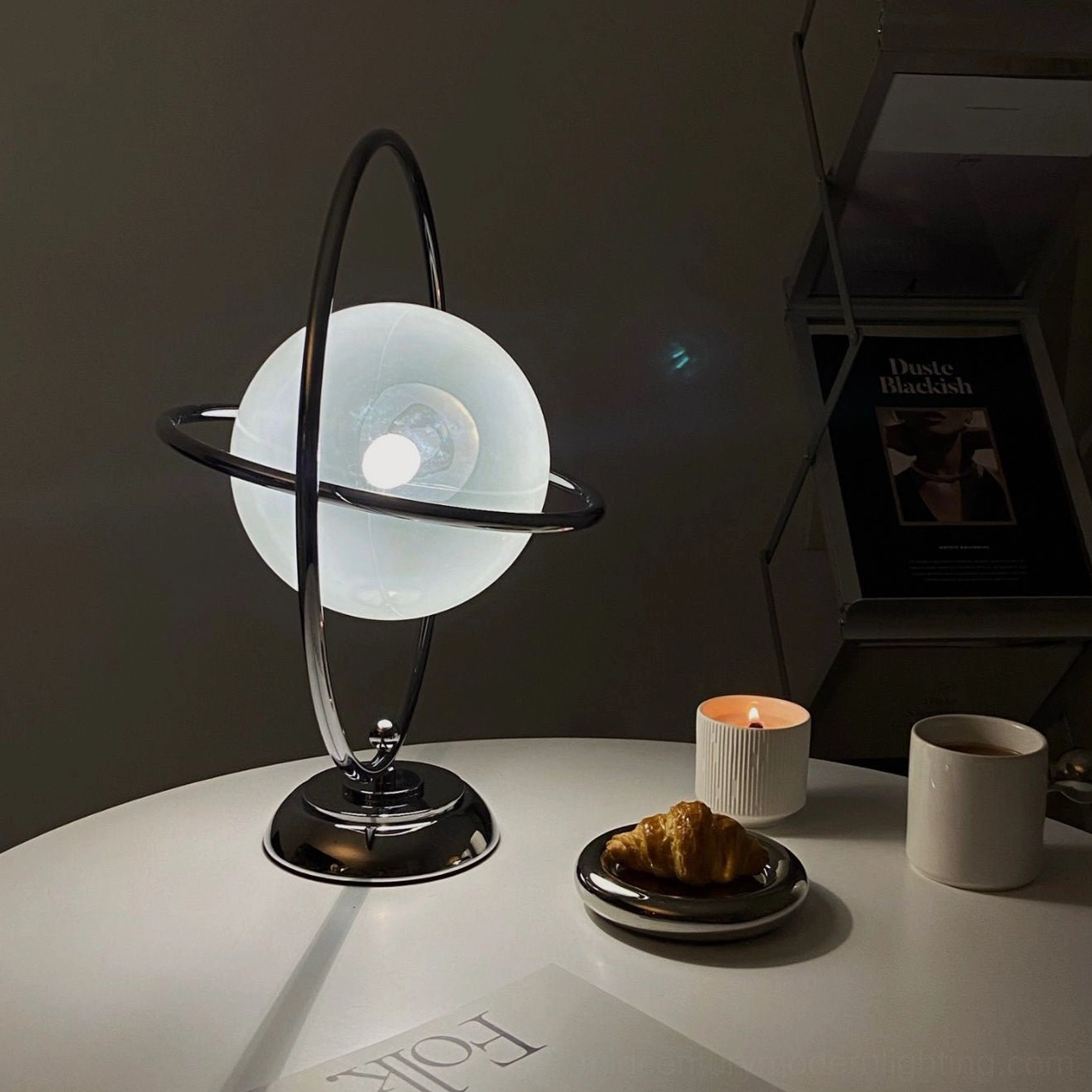 Contemporary space age planet lamp with polished chrome finish and artistic design