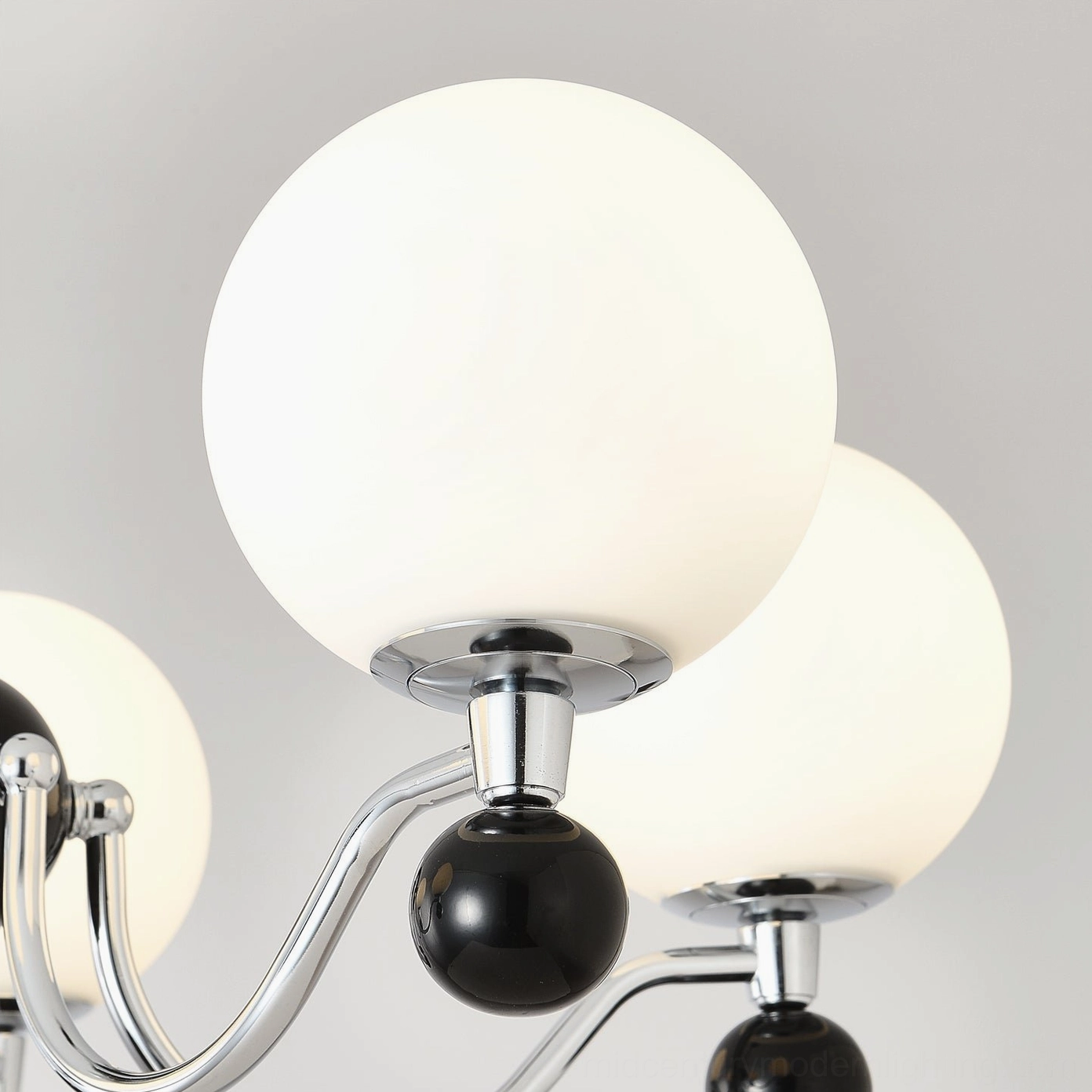 Contemporary spherical chandelier providing overhead ambient lighting in modern home