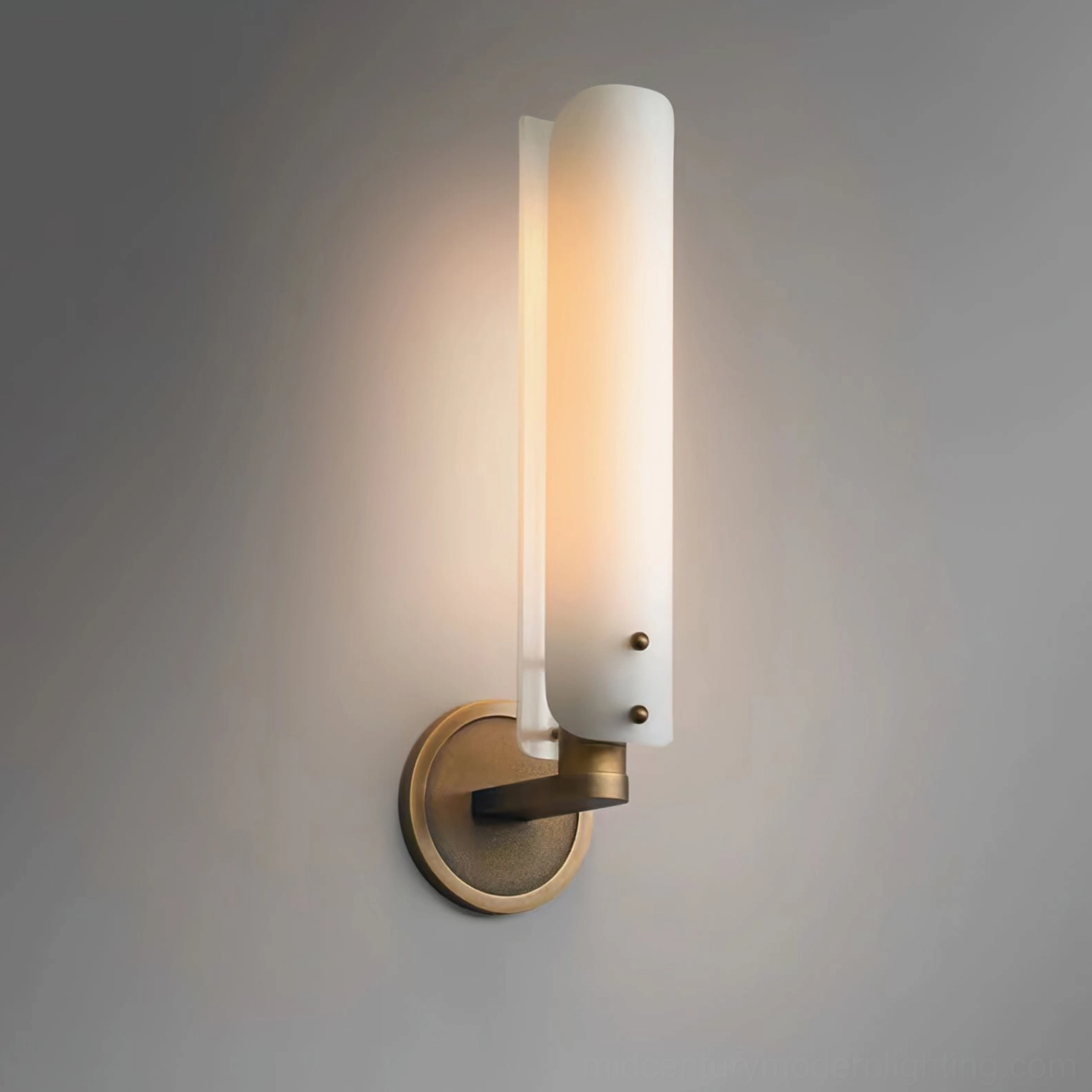 Contemporary wall sconce installation example with dual brass arms and frosted glass diffusion