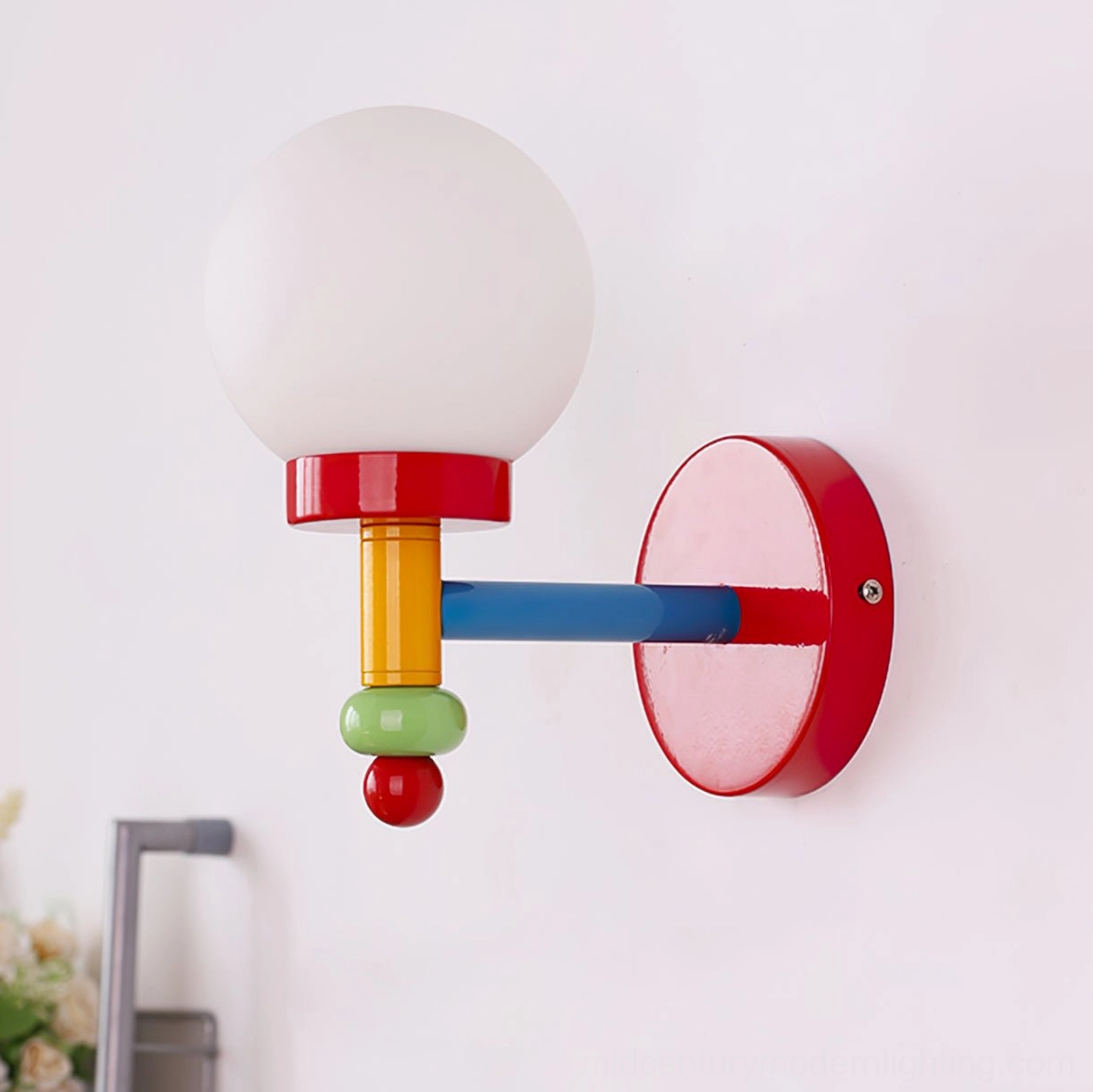 Modern glass wall sconce mounted on interior wall with reverse side angle view