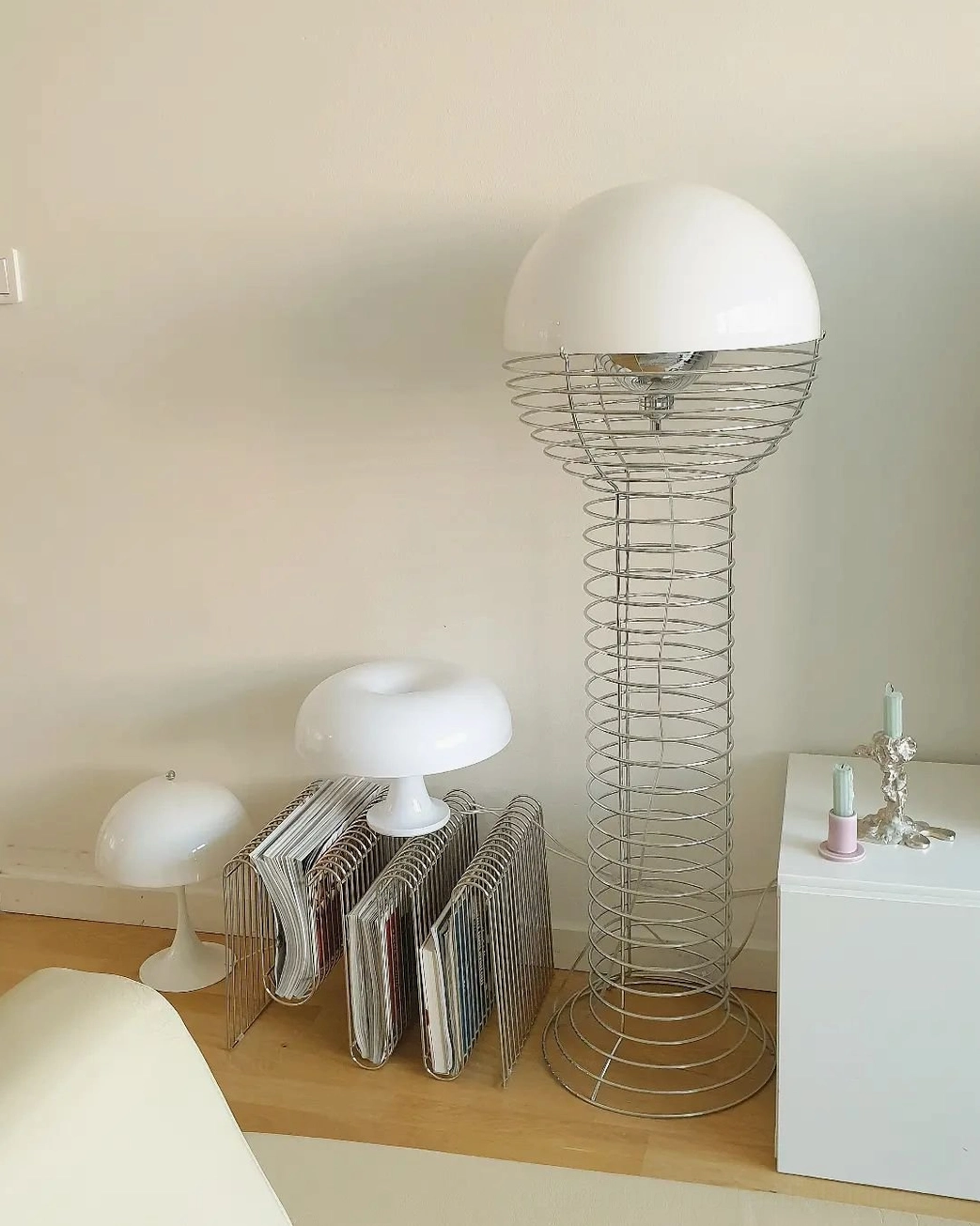 Contemporary wire floor lamp with spherical white shade and architectural steel wire framework