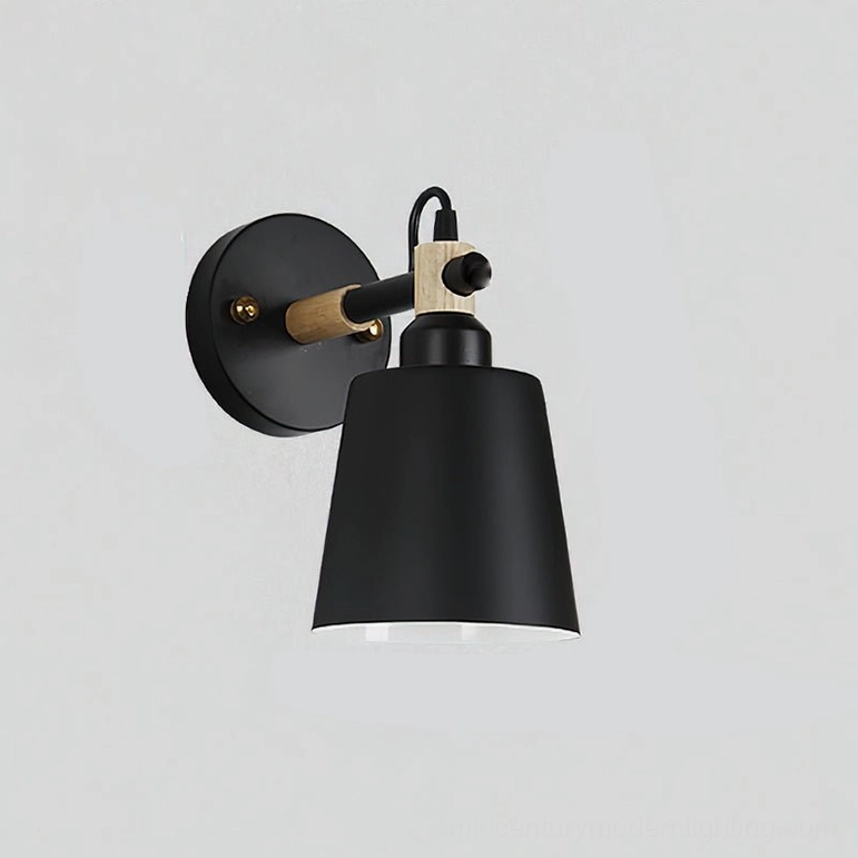 Copita adjustable wall lamp featuring matte black metal construction with natural wood accents on white background