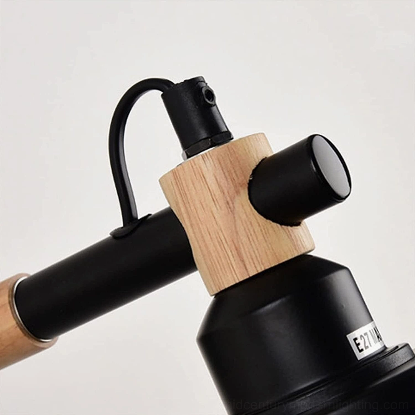 Extreme close-up of Copita lamp socket connection showing E27 compatibility and wood mounting detail