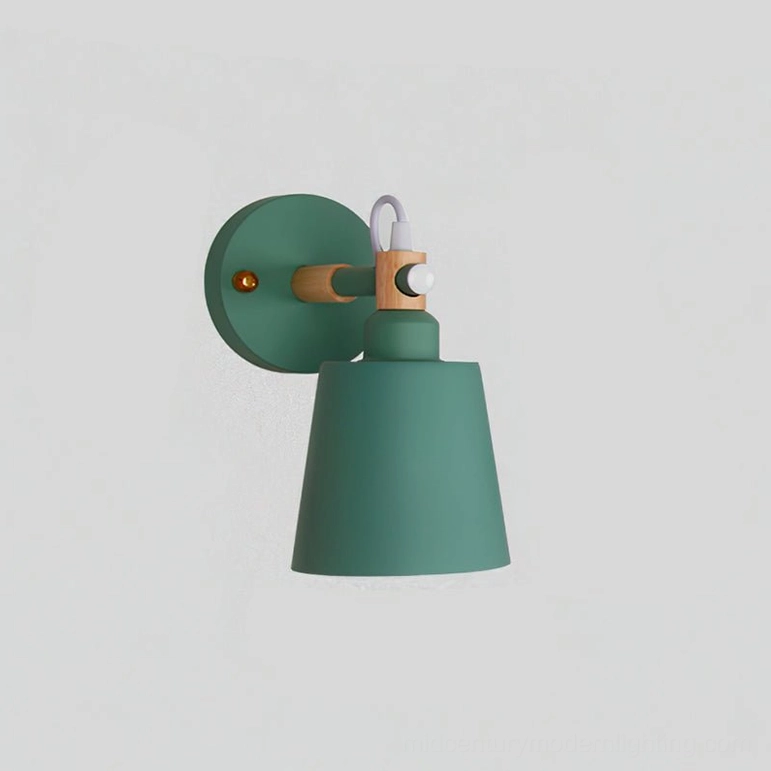 Copita wall lamp in forest green and wood tones showcasing Nordic minimalist design aesthetic