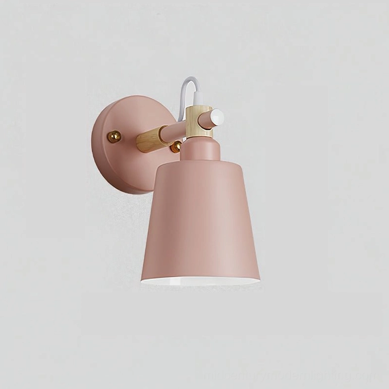 Copita wall lamp in soft pink and natural wood finish on white background minimalist style