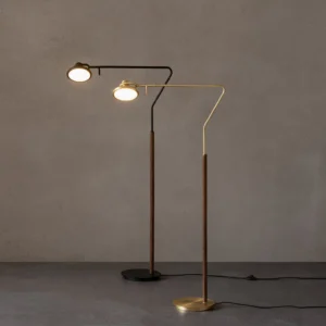 Dual-head Cos modern floor lamp in black and brass gold finish, two-tone industrial minimalist design