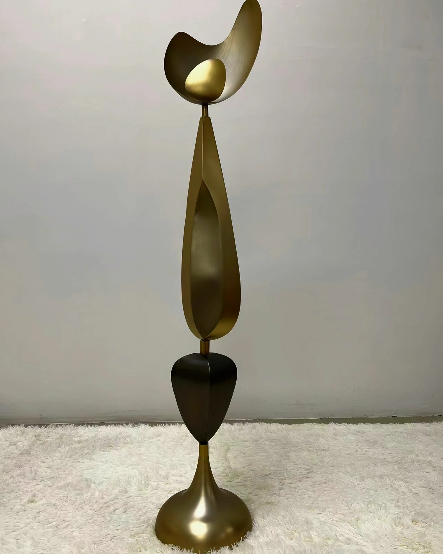 Streamlined Cosmo abstract floor lamp with sleek two-tone bronze and black metal silhouette