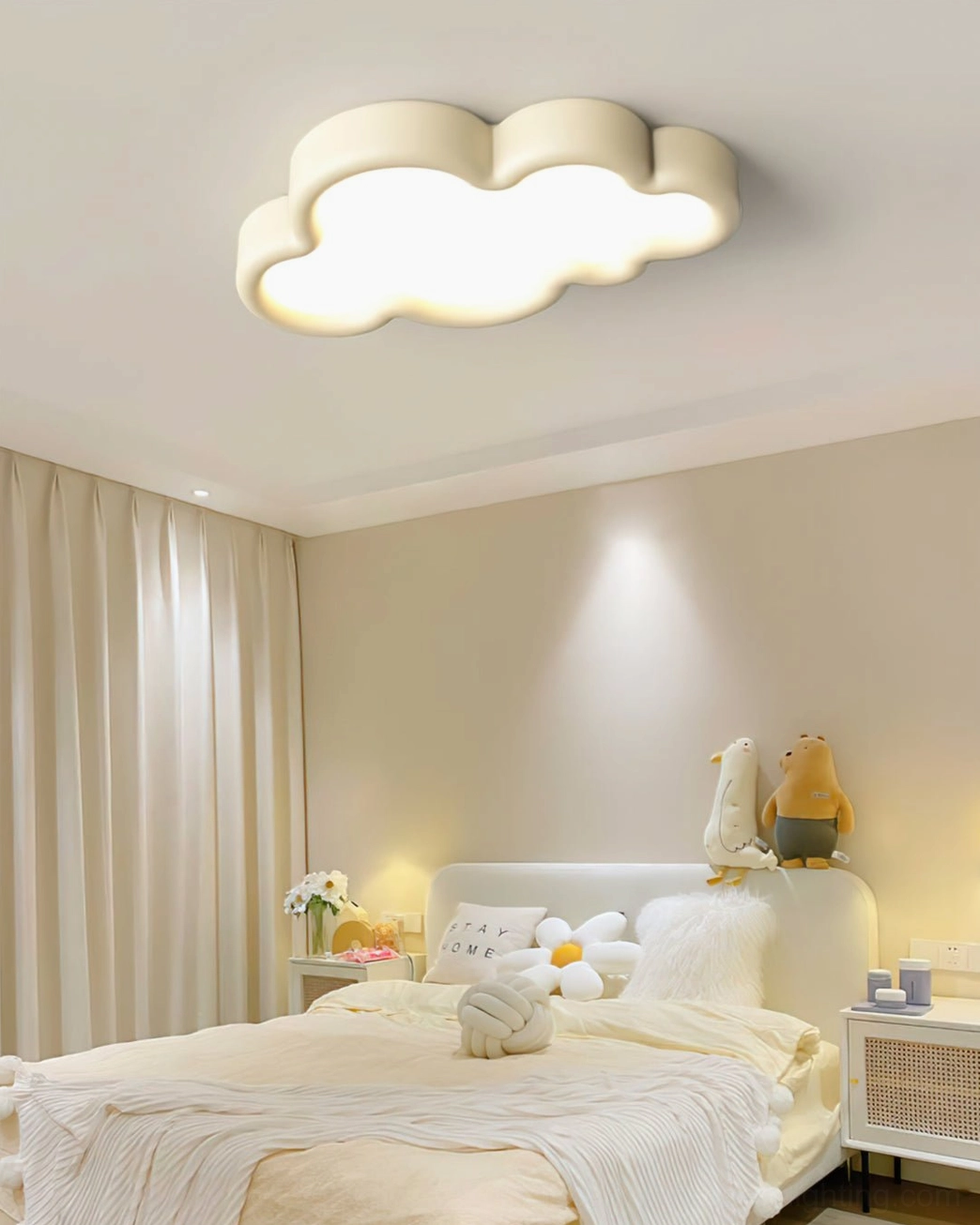 Cloud ceiling lamp with soft warm glow in cozy plush bedroom setting