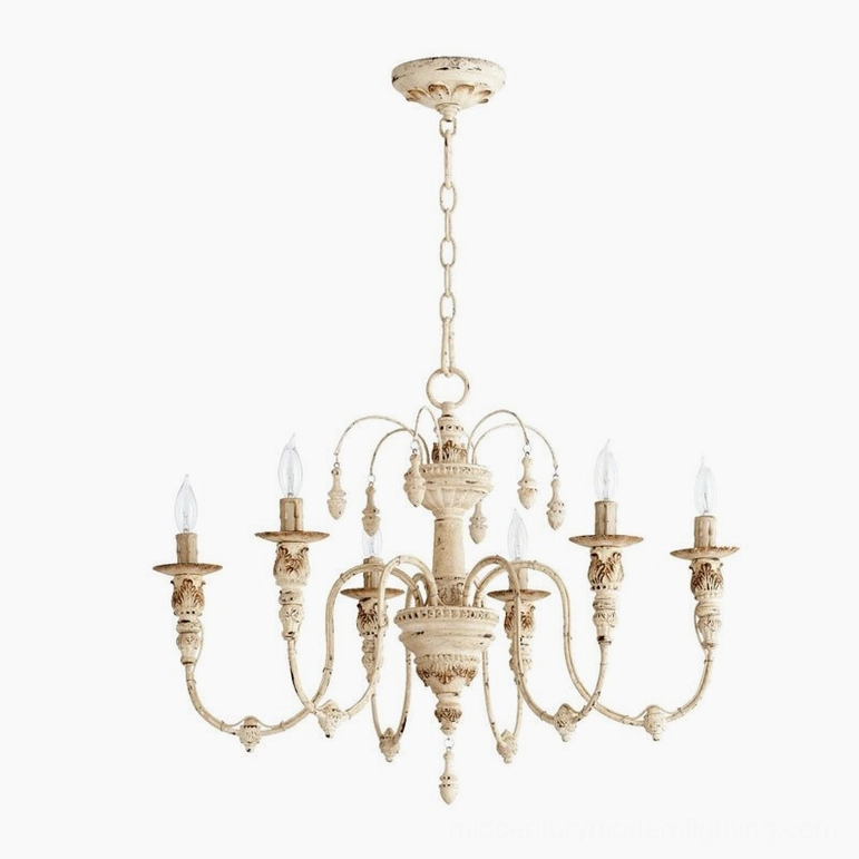 Distressed cream-white candelabra chandelier with six delicate carved arms and refined details