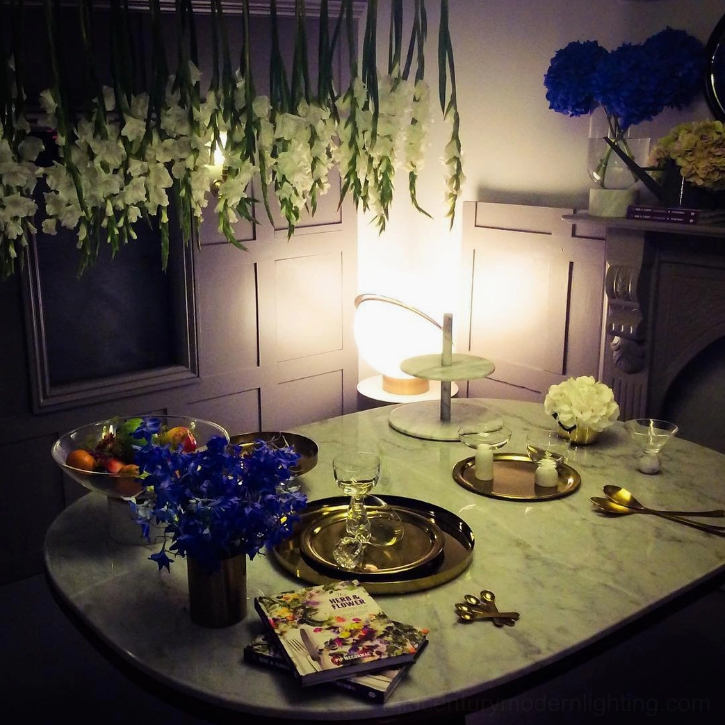 Crescent Table Light eye-level view on luxury formal dining table creating elegant table ambiance