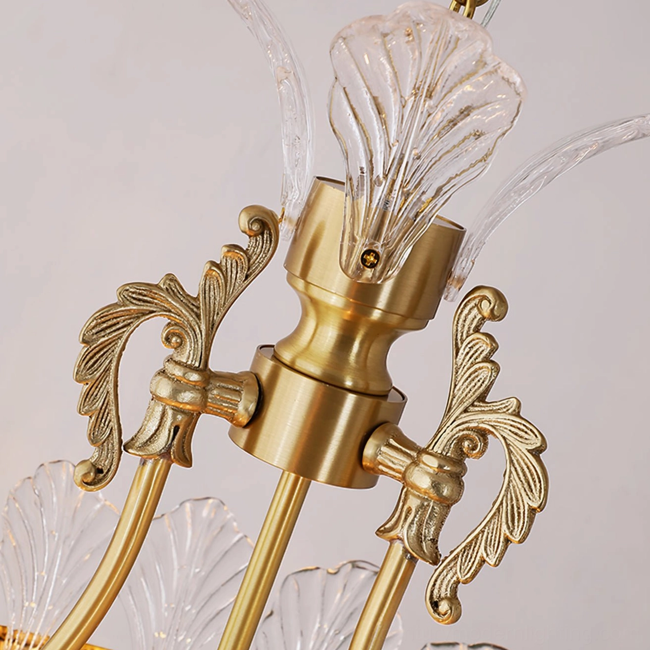 Brass crinoline chandelier with cascading crystal elements in contemporary home
