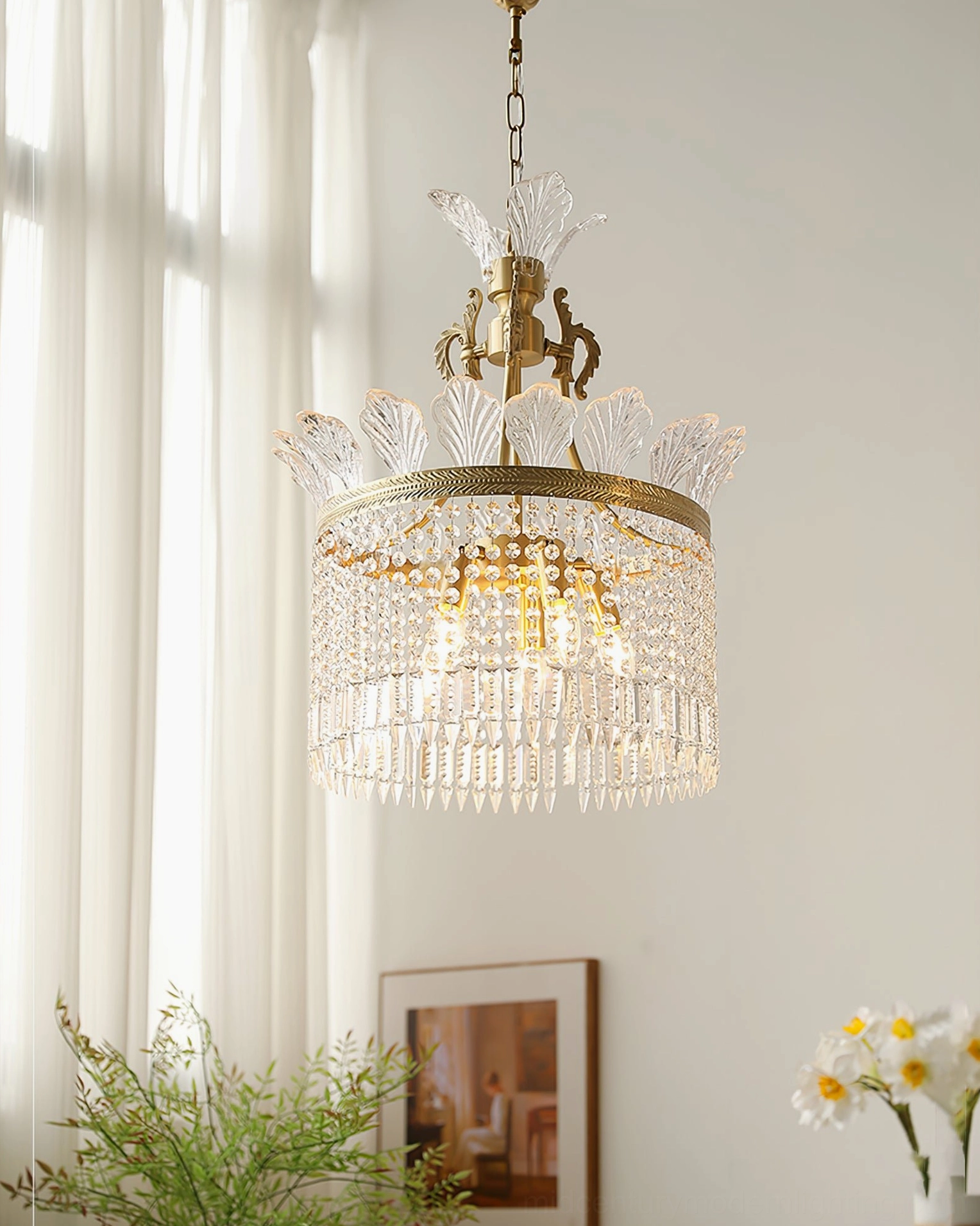 Compact crinoline chandelier with glowing internal bulbs in sophisticated interior
