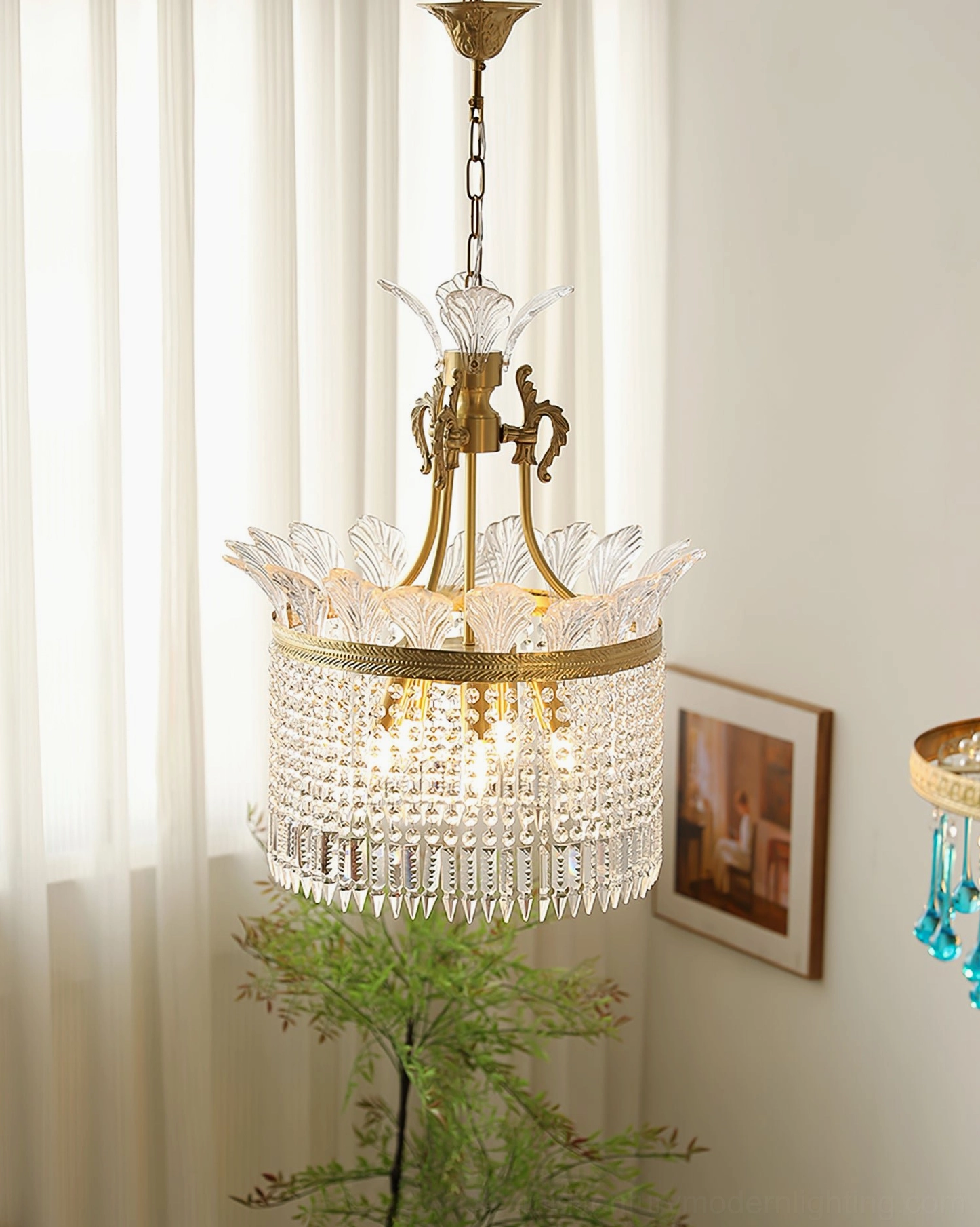 Illuminated brass crinoline chandelier with dense crystal tassels in elegant living room