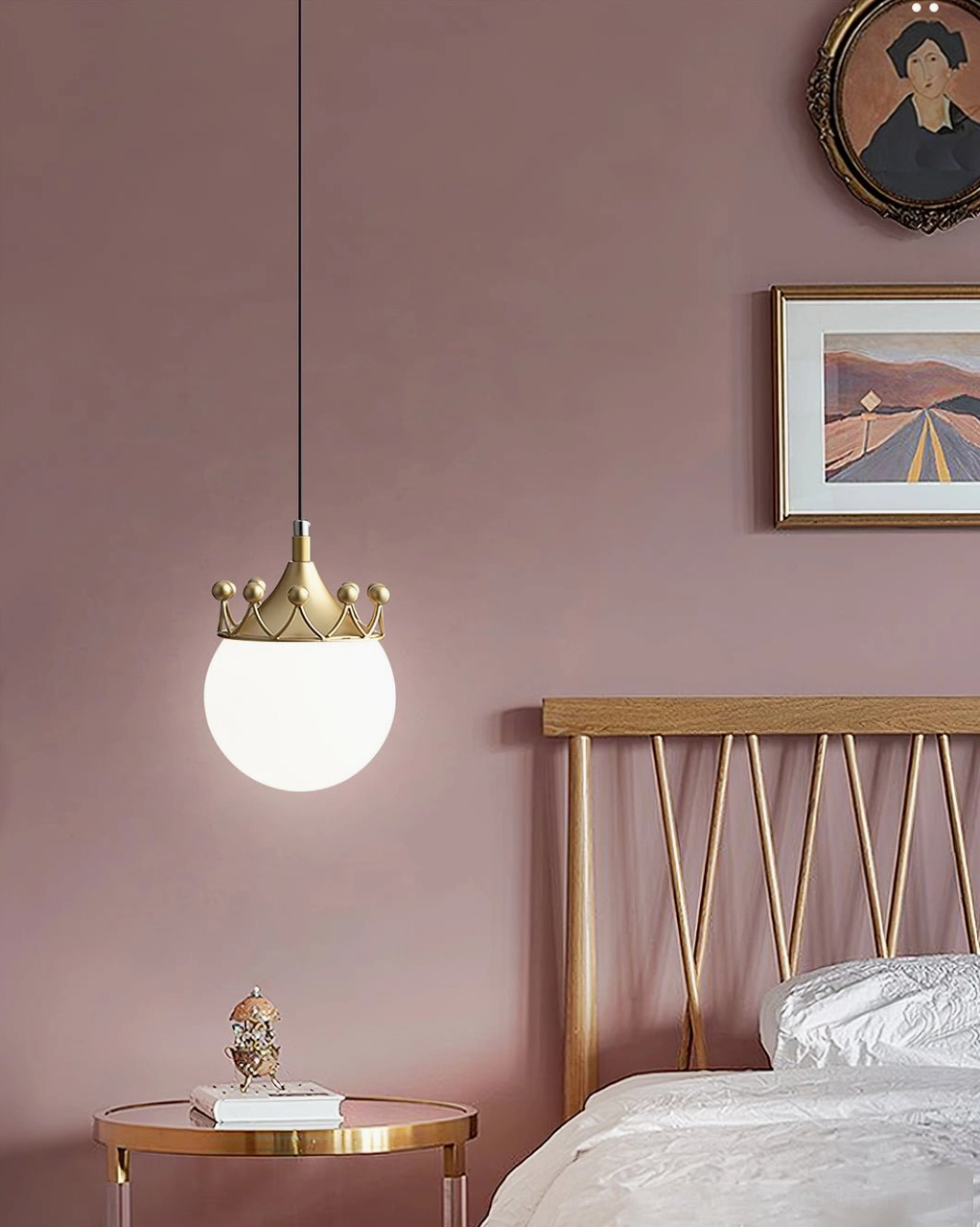 Crown-topped pendant fixture above bedside vanity area with gray and pink walls, showcasing minimalist modern design