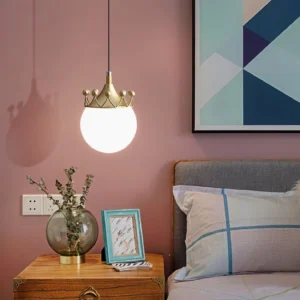 Mid-century modern crown pendant lamp hanging in bedroom with pink accent wall, warm glowing frosted glass creating ambient lighting