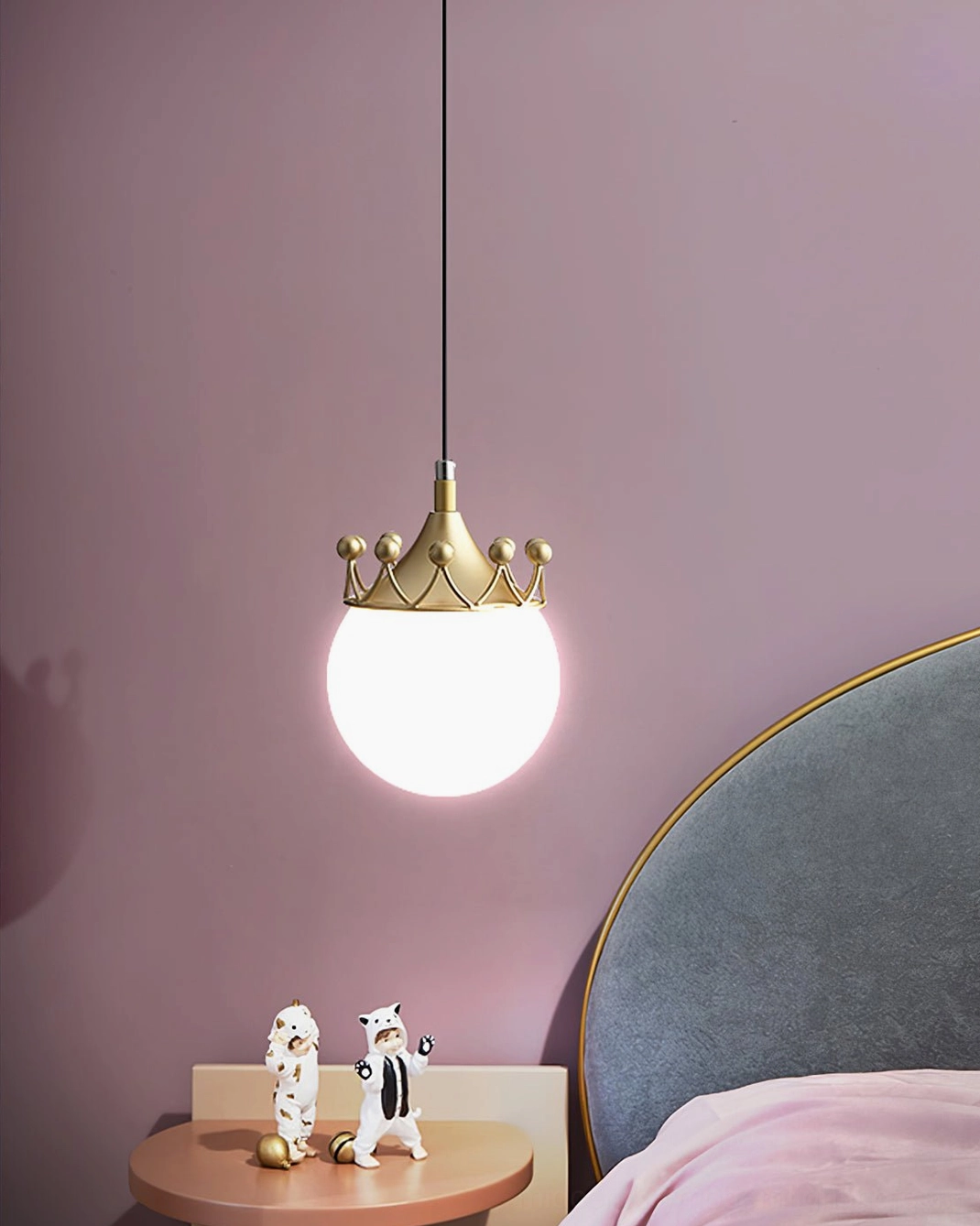 Crown globe pendant lamp installed ceiling mounting showing suspension cord and white base connection for bedroom lighting