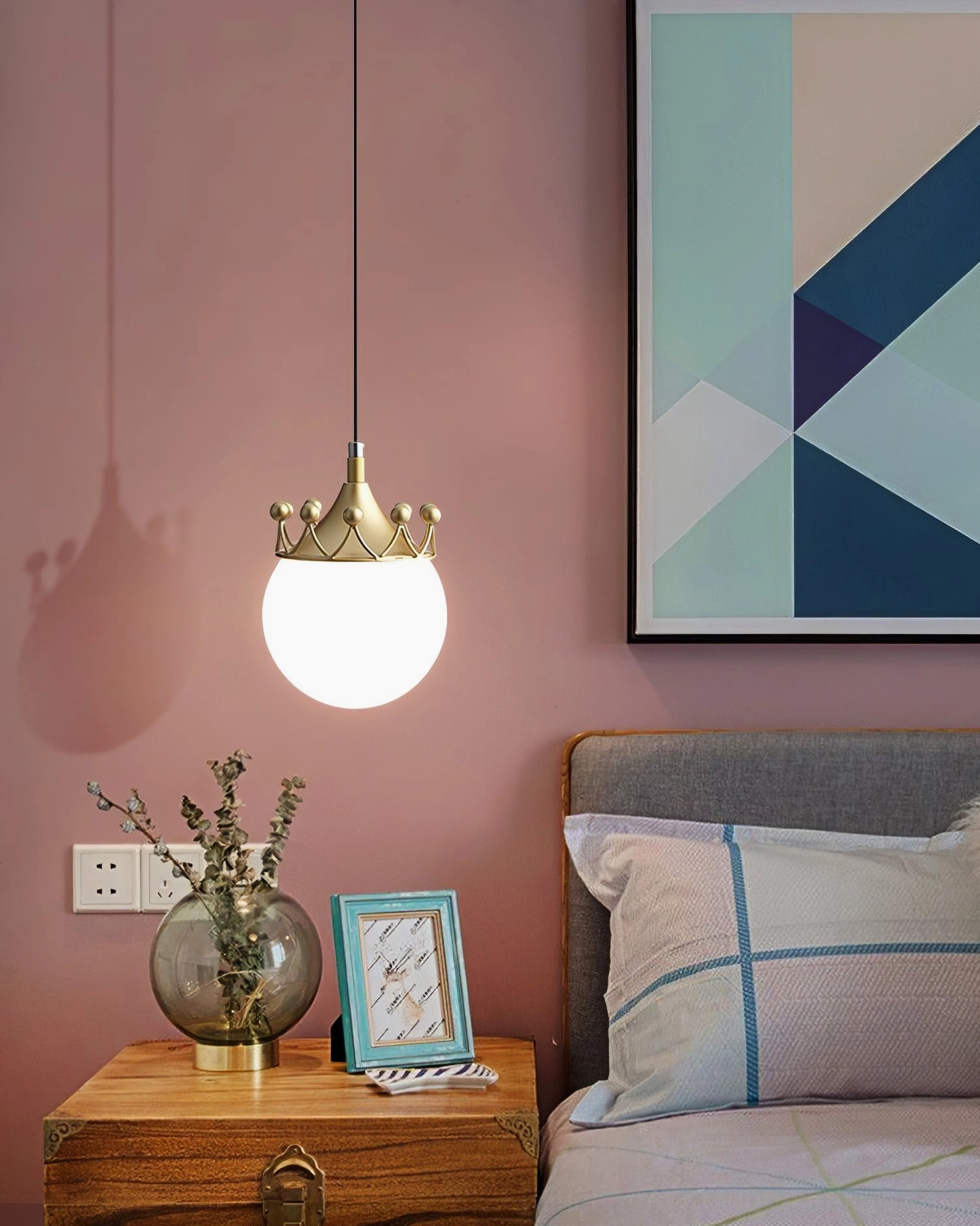 Mid-century modern crown pendant light fixture detail view showing opalescent glass diffuser and metal hardware construction
