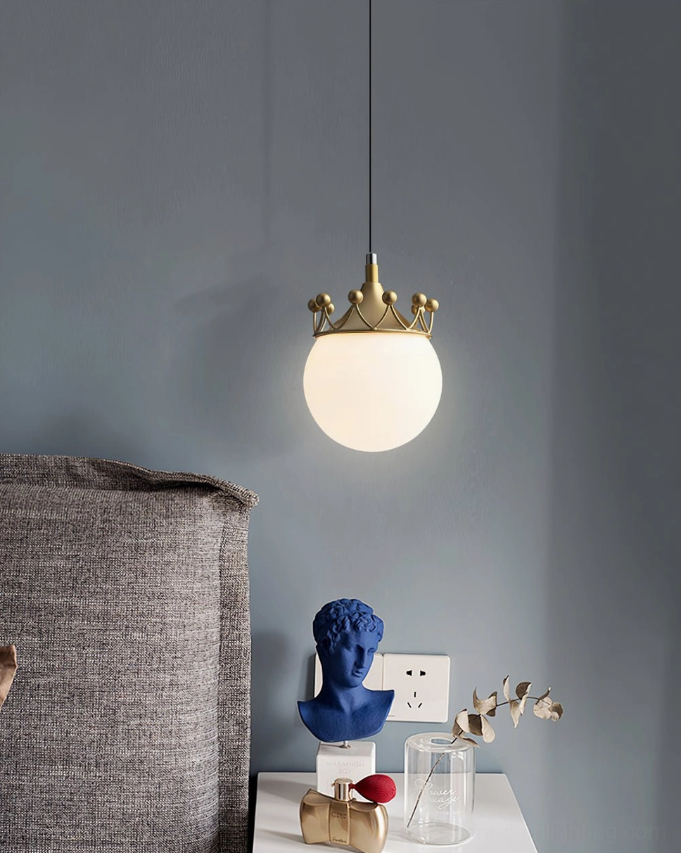 Crown pendant light fixture in contemporary bedroom with gray wall, blue art statue on nightstand below glowing globe shade