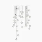 Crystal ball cluster chandelier featuring multiple clear glass globes suspended from single ceiling canopy, modern minimalist design