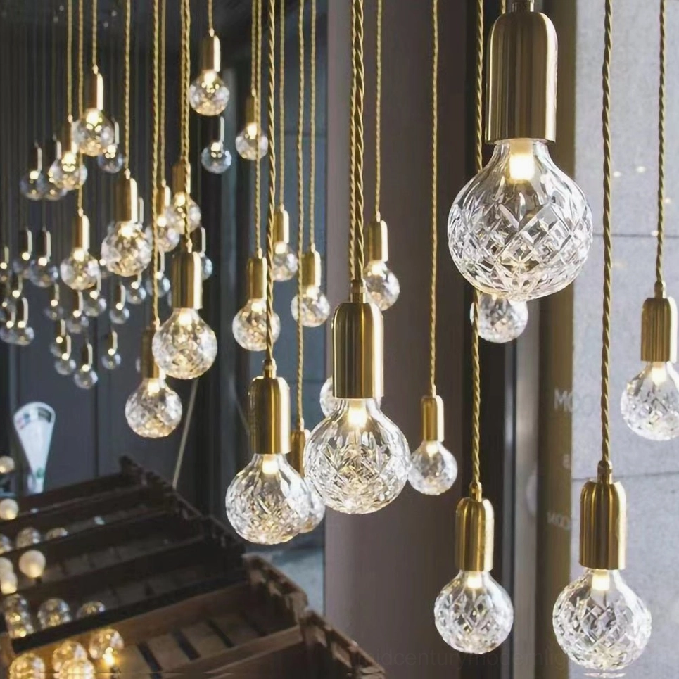 Handcrafted crystal bulb pendant showing traditional technique and modern LED technology