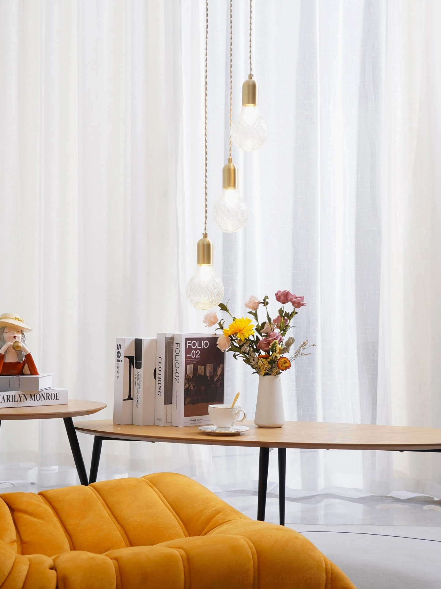 Crystal bulb pendant light with LED bulb installed showing warm light output through faceted glass