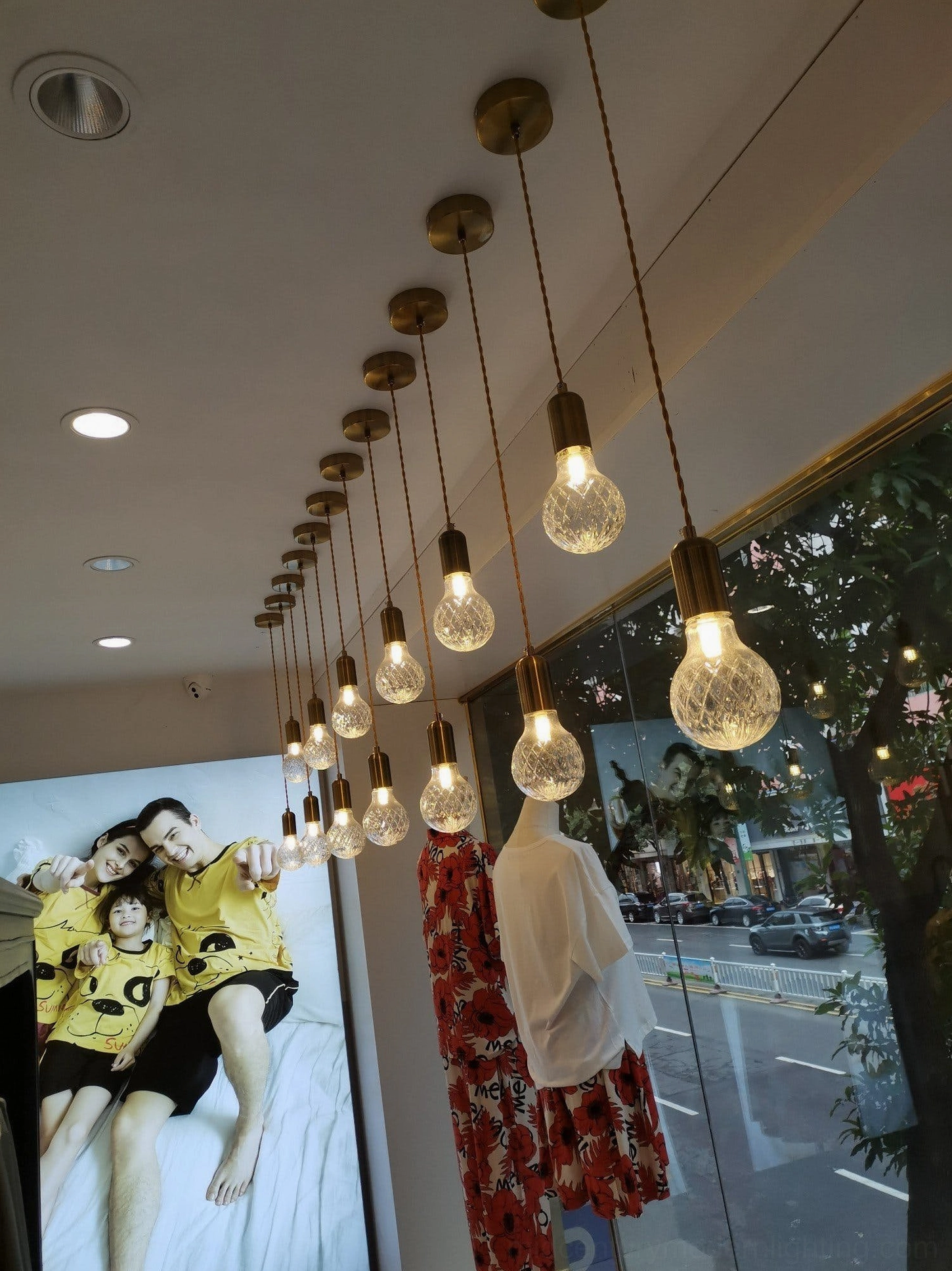 Crystal bulb pendant lamp in contemporary living space with mid-century modern furnishings
