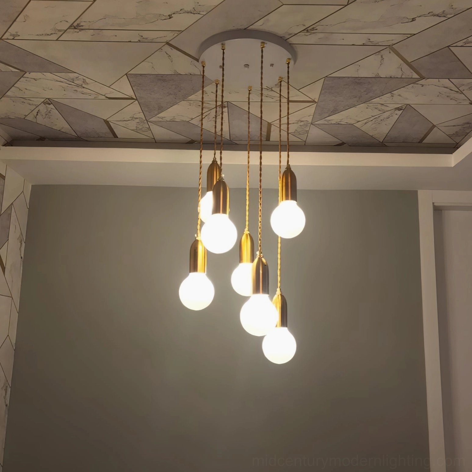 Detailed view of hand-cut crystal pattern on bulb pendant shade with LED light source
