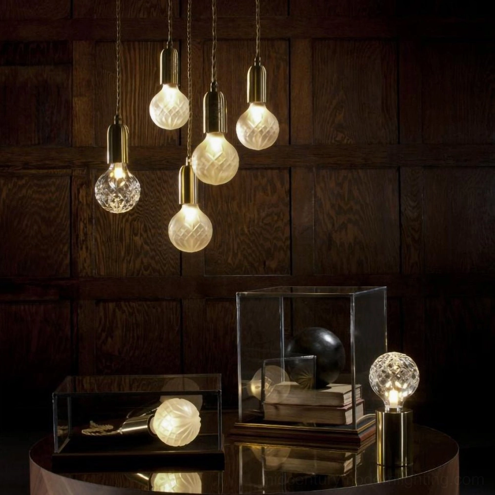 Hand-crafted crystal bulb table lamp showing intricate facet cutting and light diffusion